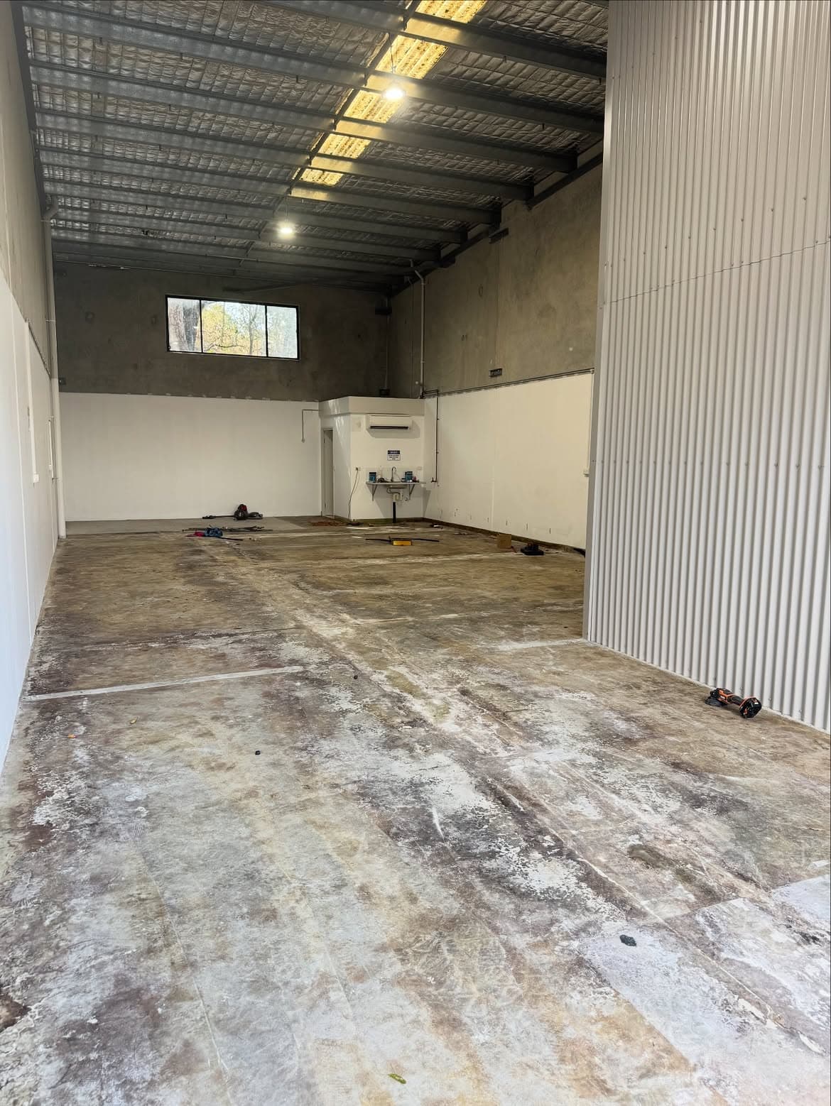 Before: industrial floor by Gold Coast Epoxy