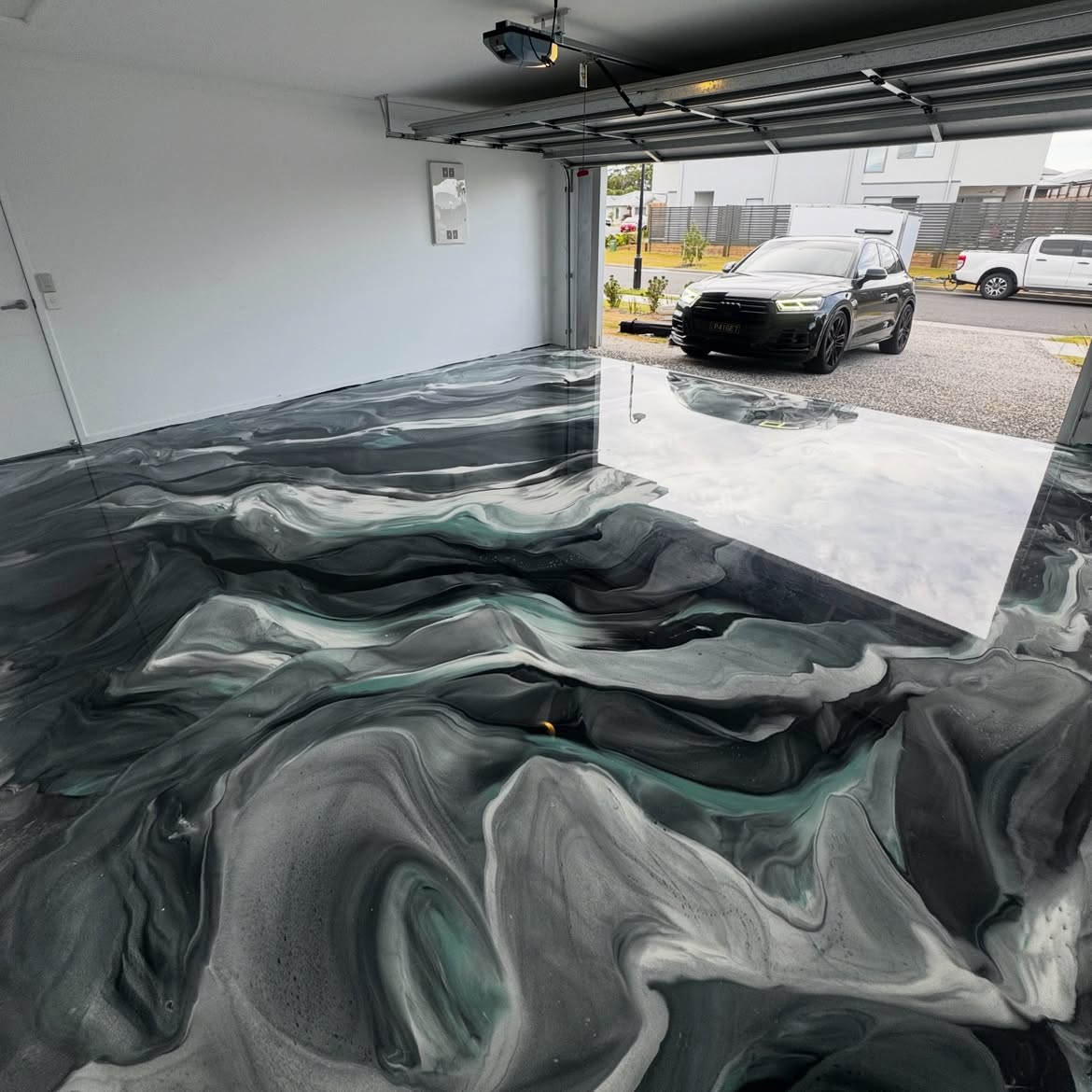 Premium metallic epoxy garage floor by Gold Coast Epoxy